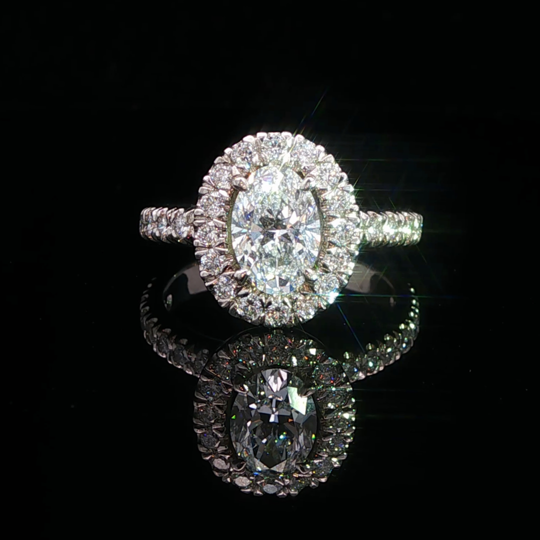 Oval Cut Diamond Halo Engagement Ring in Platinum