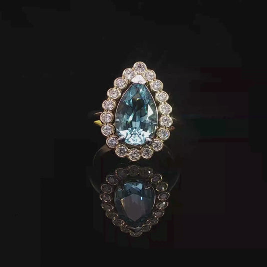 Pear-Shaped Aquamarine and Diamond Halo Ring in 18ct Yellow Gold