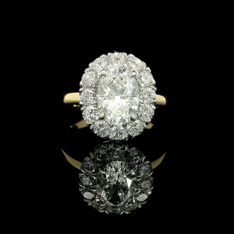 Oval Cut Halo Engagement Ring in Platinum & 18ct Yellow Gold | Brinkhaus Jewellers