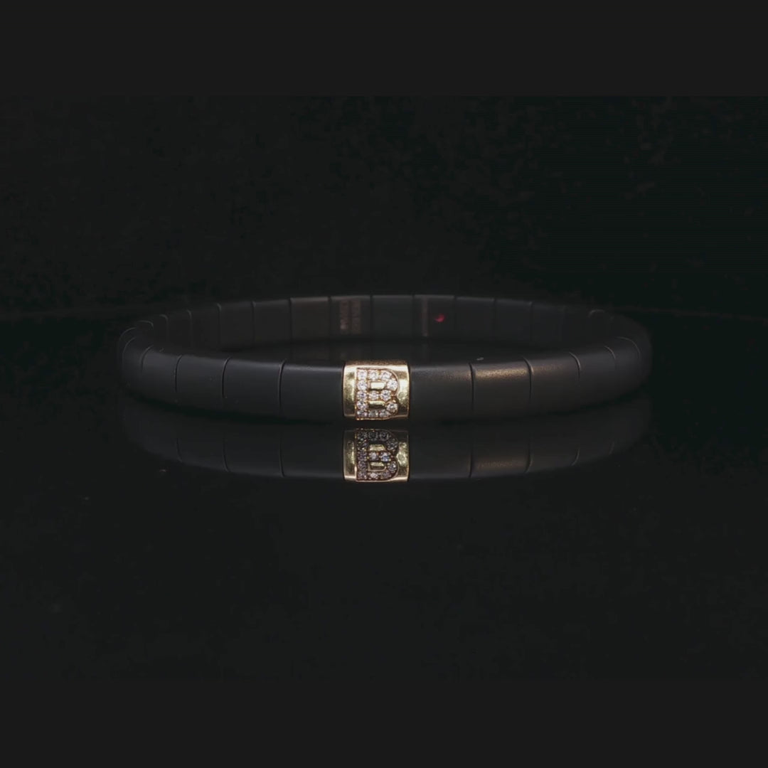 Black Ceramic B Initial Diamond Stretch Bracelet in 18ct Yellow Gold | Brinkhaus Jewellers 