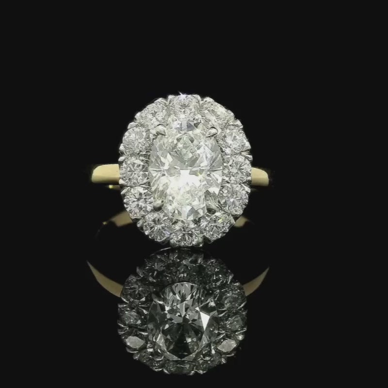 Oval Cut Halo Engagement Ring in Platinum & 18ct Yellow Gold | Brinkhaus Jewellers